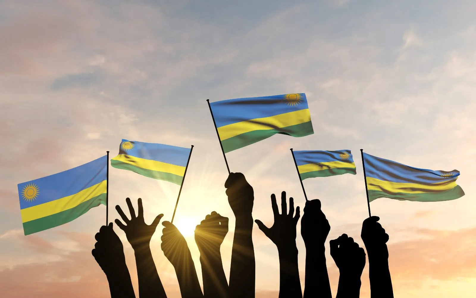 Siluetas de manos levantadas ondeando banderas de Ruanda?w=200&h=150