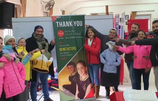 Cristianos que reciben ayuda de ACN. Cru00e9dito: Ayuda a la Iglesia Necesitada. 