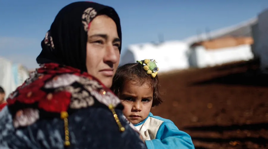 Refugiada siria con su hija. Foto: Caritas Internationalis.