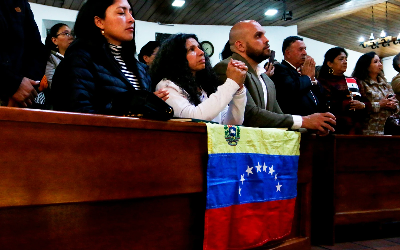 Migrantes venezolanos durante la Misa que el Cardenal Baltazar Porras celebró en Quito (Ecuador) el 10 de septiembre de 2024.?w=200&h=150